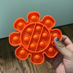 4 pop it’s ( a turtle,tie dye square,orange flower,green bat